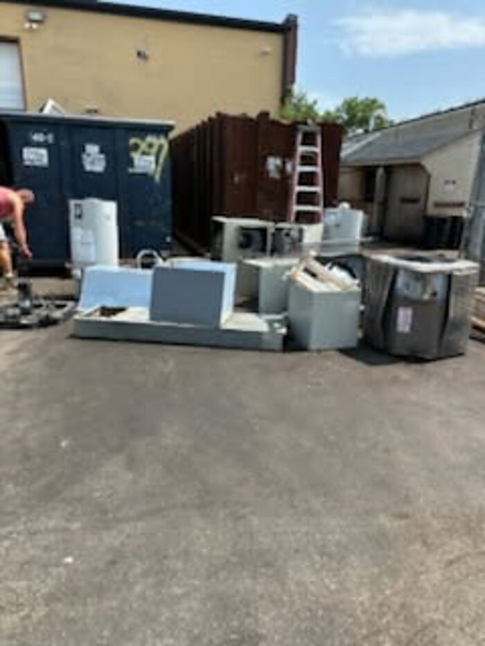 Appliances and AC units staged for pickup